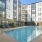 Resort-style swimming pool with lounge seating