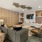 A large room with a media center and couches